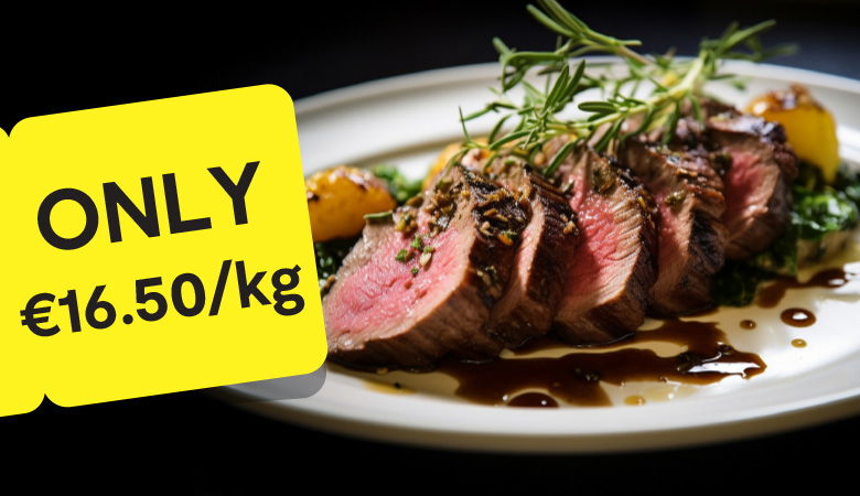 Promotional image showcasing a cooked leg of lamb garnished with roasted garlic, herbs, and mushrooms on a white platter. In the background, a side of steamed broccoli is visible. A yellow tag on the left displays the price: 'ONLY €11.25/kg' in bold black text.