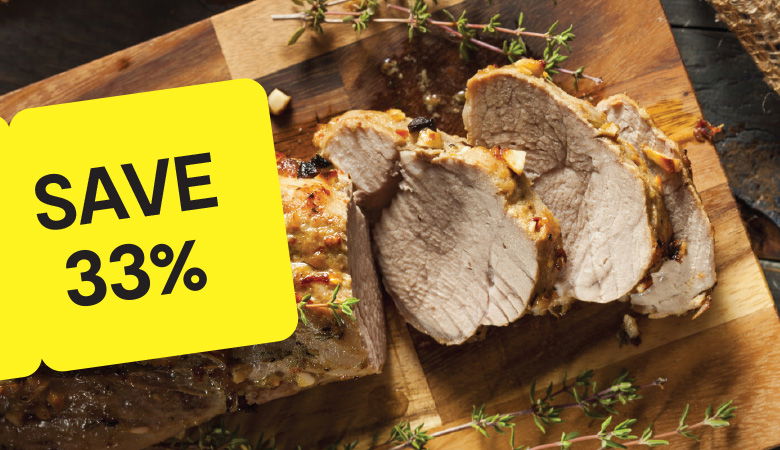 Promotional image showcasing a cooked leg of lamb garnished with roasted garlic, herbs, and mushrooms on a white platter. In the background, a side of steamed broccoli is visible. A yellow tag on the left displays the price: 'ONLY €11.25/kg' in bold black text.