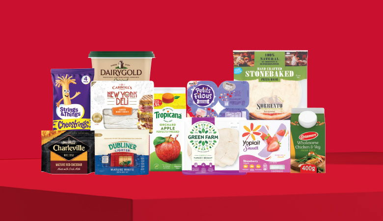 A promotional image showing a variety of food products arranged on a red background.