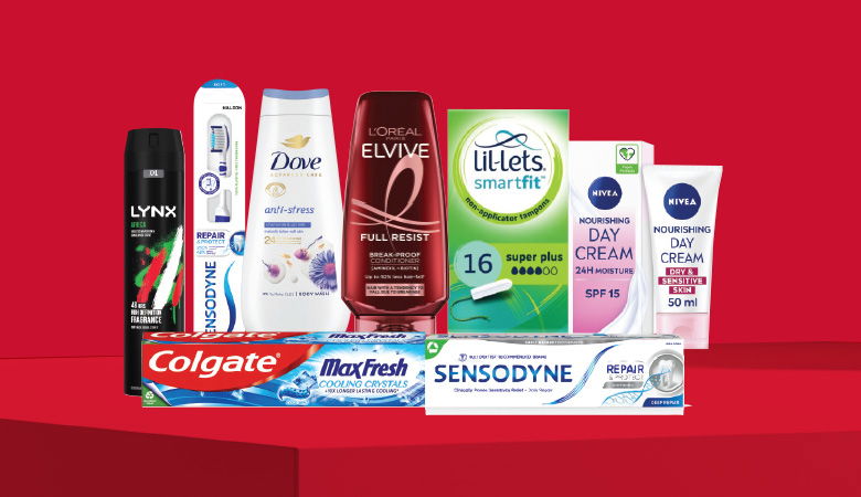 A promotional image showcasing various personal care products against a red backdrop.