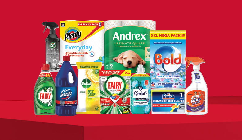 A promotional image showcasing various household cleaning and laundry products against a red backdrop.