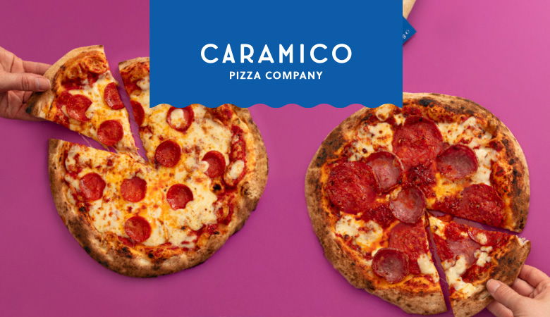 An advertisment for Caramico piza, featuring two of their pizzas