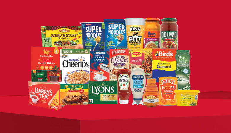 A promotional image displaying various grocery items against a red backdrop.