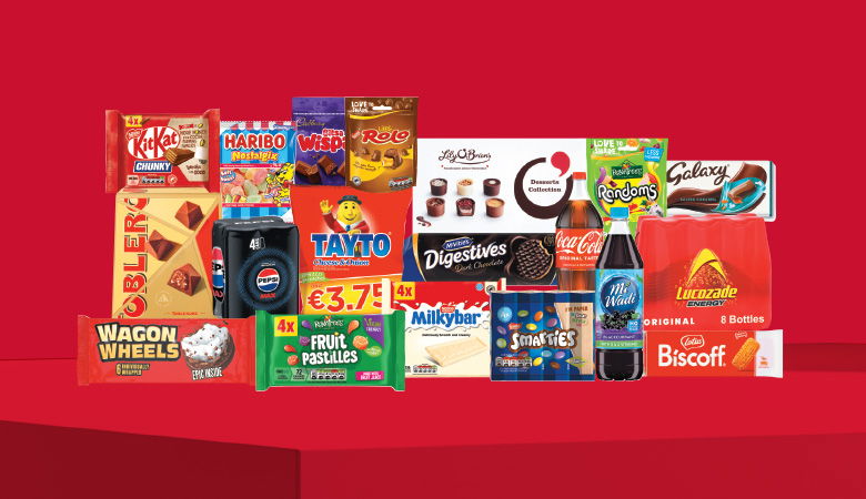 A promotional image showcasing a variety of snack foods and drinks against a red backdrop.