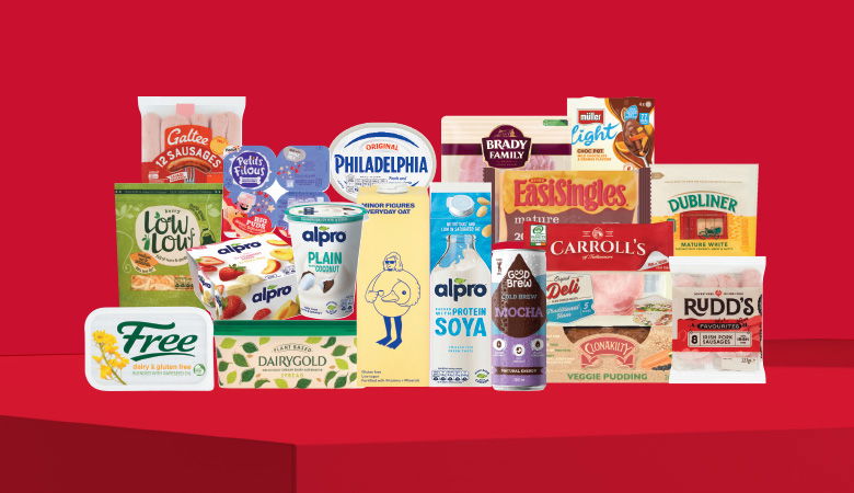 A promotional image showing a variety of food products arranged on a red background.