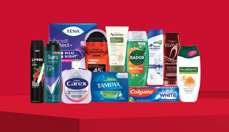 A promotional image showcasing various personal care products against a red backdrop.