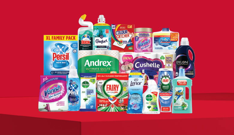 A promotional image showcasing various household cleaning and laundry products against a red backdrop.