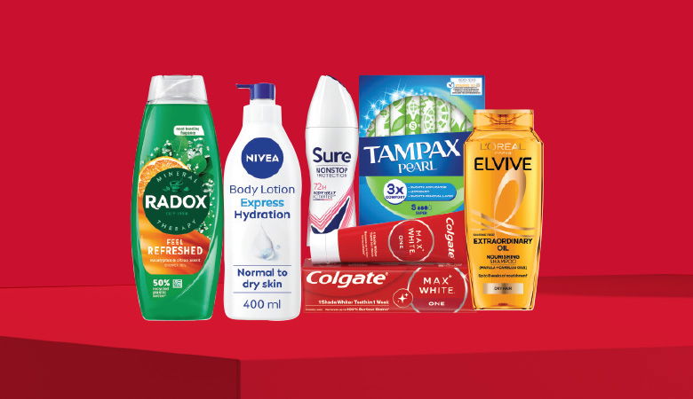 A promotional image showcasing various personal care products against a red backdrop.