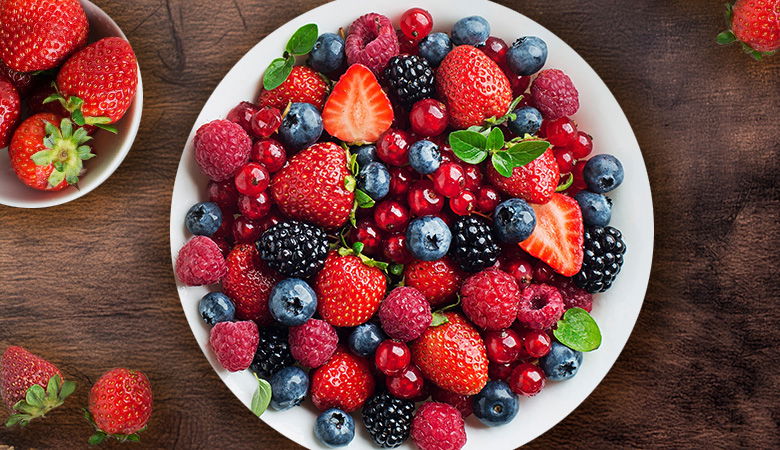 Summer fruits, lots of mixed berries, including zara strawberries