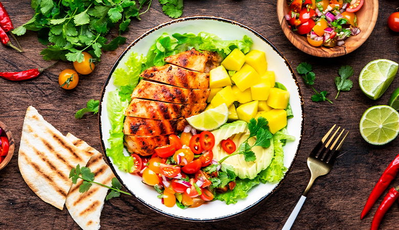 a table with a plate of salad
