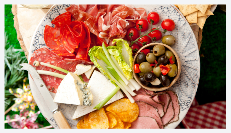 a table with a plate of salad