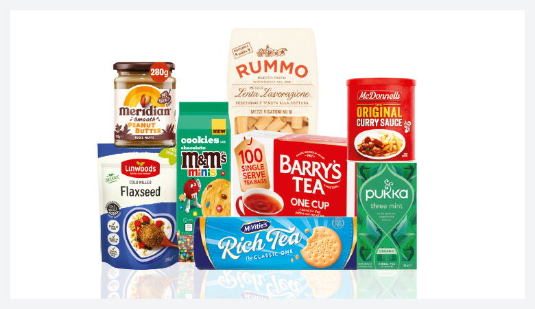 A promotional image displaying various grocery items against a red backdrop.