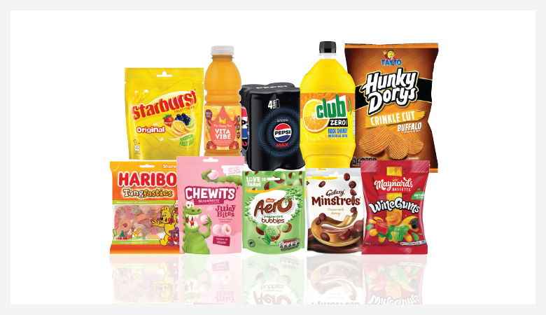 A promotional image showcasing a variety of snack foods and drinks against a red backdrop.