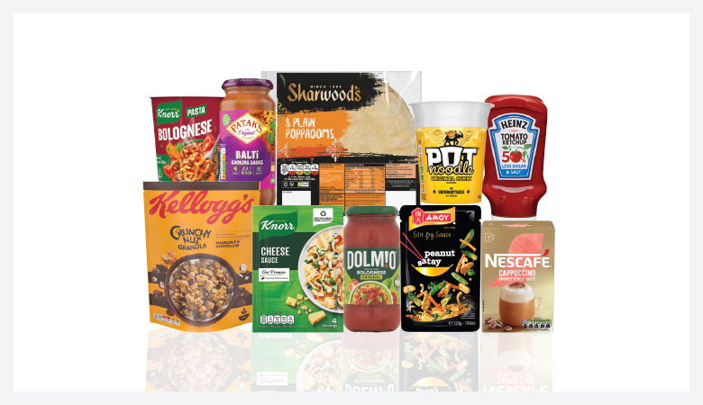 A promotional image displaying various grocery items against a red backdrop.