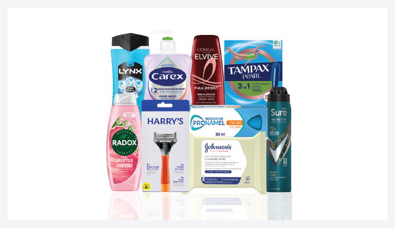 A promotional image showcasing various personal care products against a red backdrop.