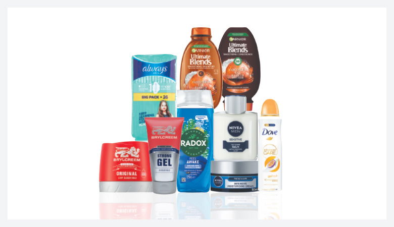 A promotional image showcasing various personal care products against a red backdrop.