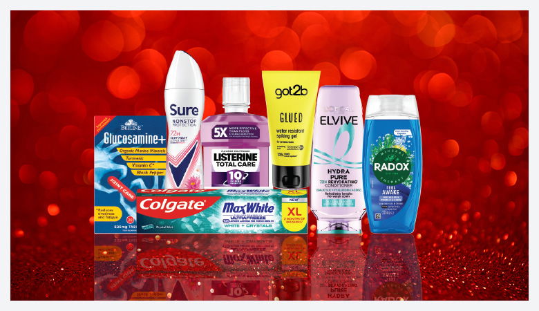 A promotional image showcasing various personal care products against a red backdrop.
