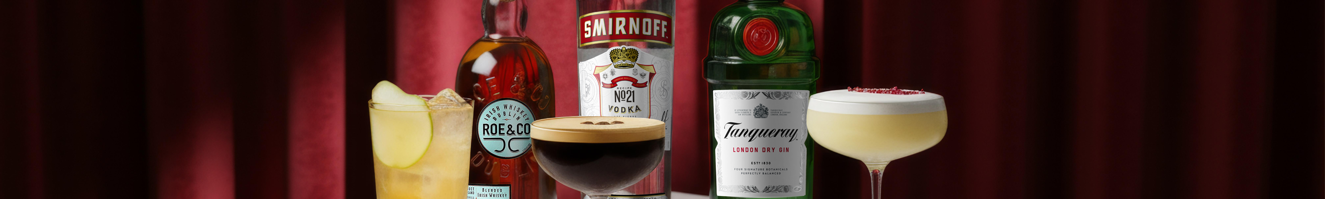 A selection of alcohol cocktails made with Roe & Co whiskey, Tanqueray gin and Smirnoff vodka