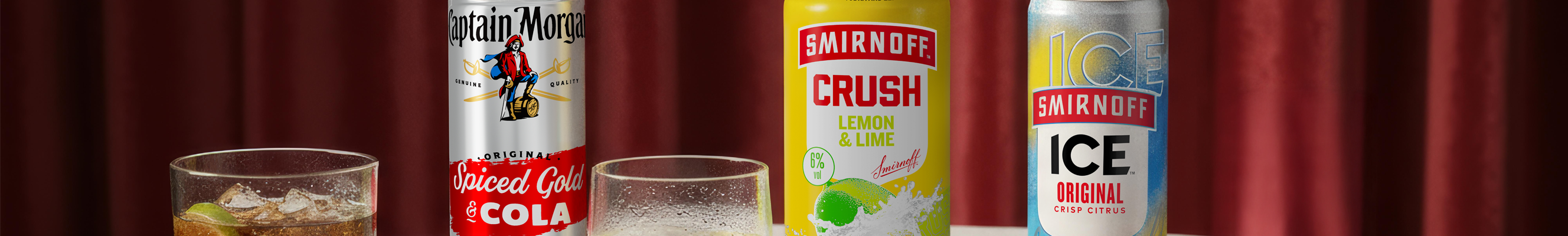 A selection of alcohol mixed drinks, like smirnoff ice and captain morgan and coke