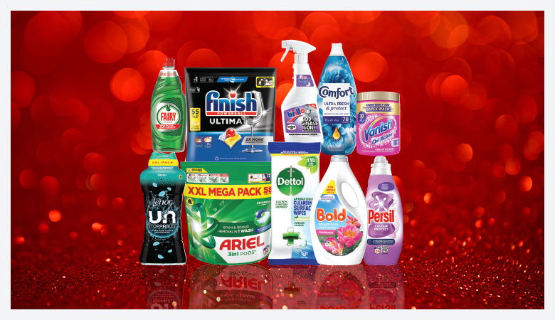 A promotional image showcasing various household cleaning and laundry products against a red backdrop.