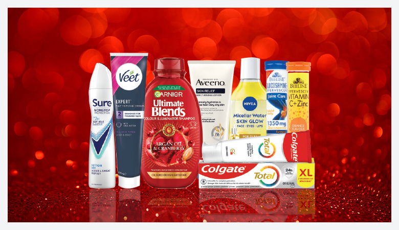 A promotional image showcasing various personal care products against a red backdrop.