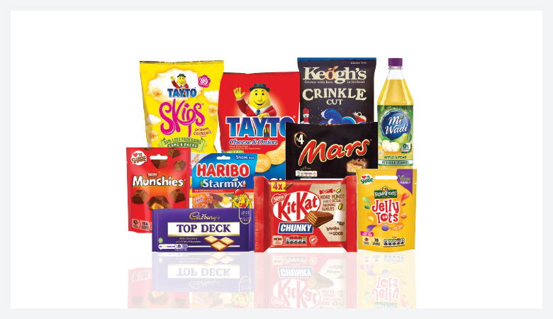 A promotional image showcasing a variety of snack foods and drinks against a red backdrop.