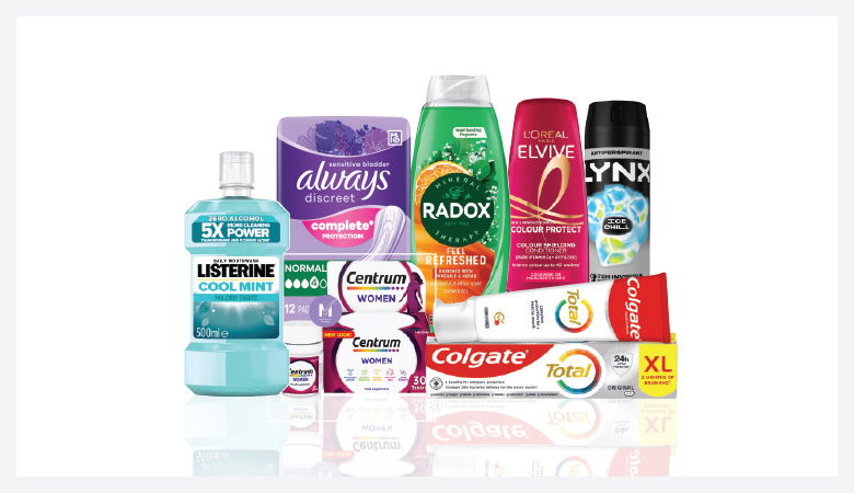 A promotional image showcasing various personal care products against a red backdrop.