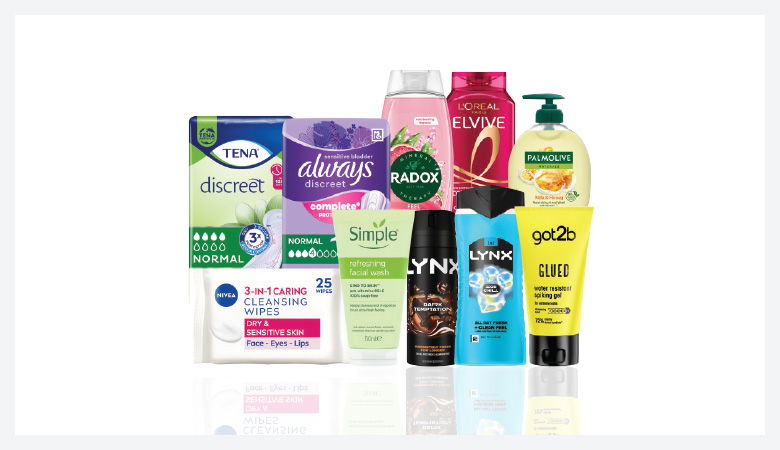 A promotional image showcasing various personal care products against a red backdrop.