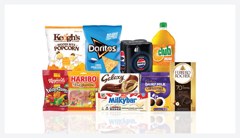 A promotional image showcasing a variety of snack foods and drinks against a red backdrop.