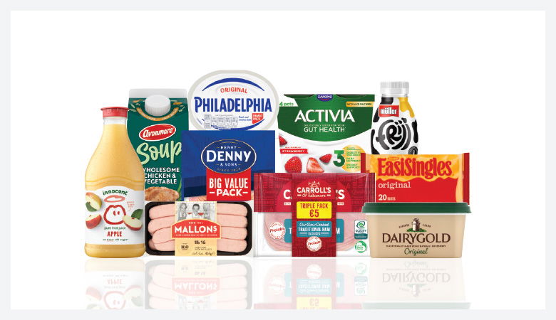 A promotional image showing a variety of food products arranged on a red background.