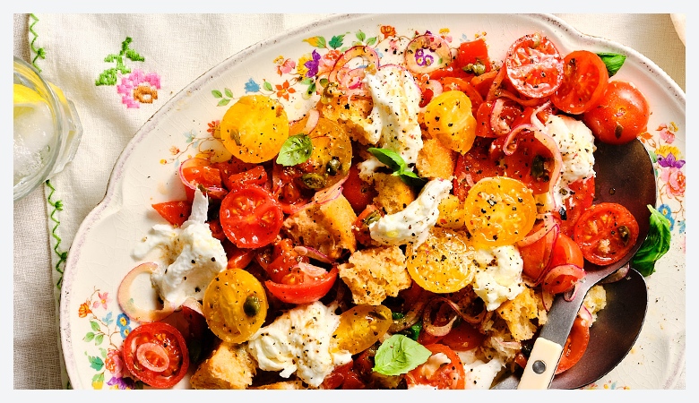 a table with a plate of salad