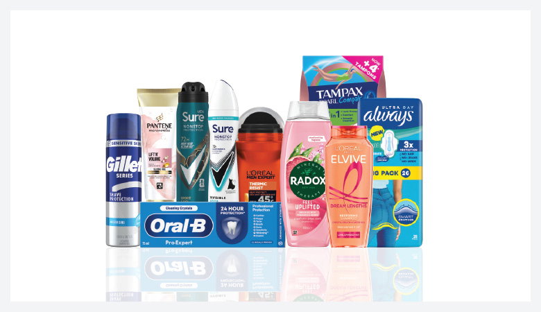 A promotional image showcasing various personal care products against a red backdrop.