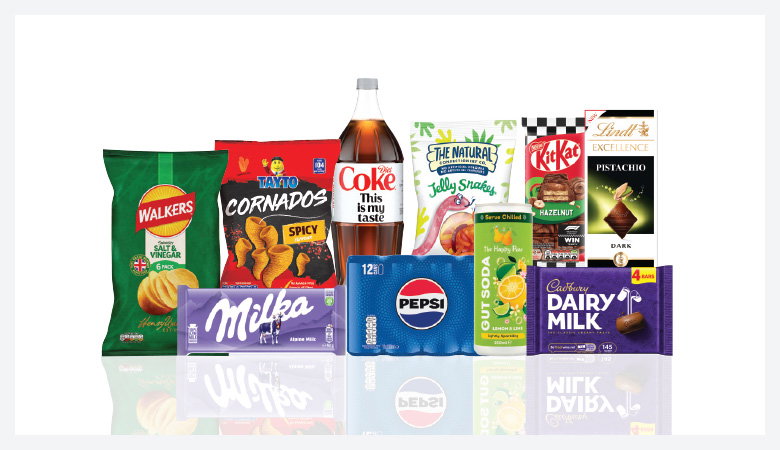 A promotional image showcasing a variety of snack foods and drinks against a red backdrop.