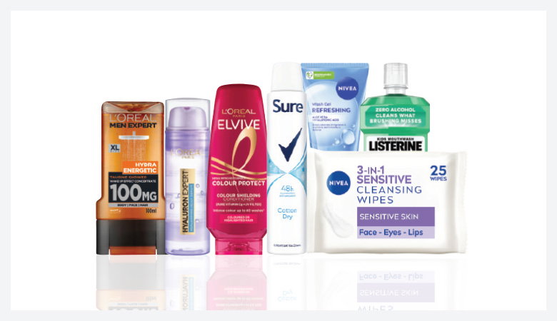 A promotional image showcasing various personal care products against a red backdrop.